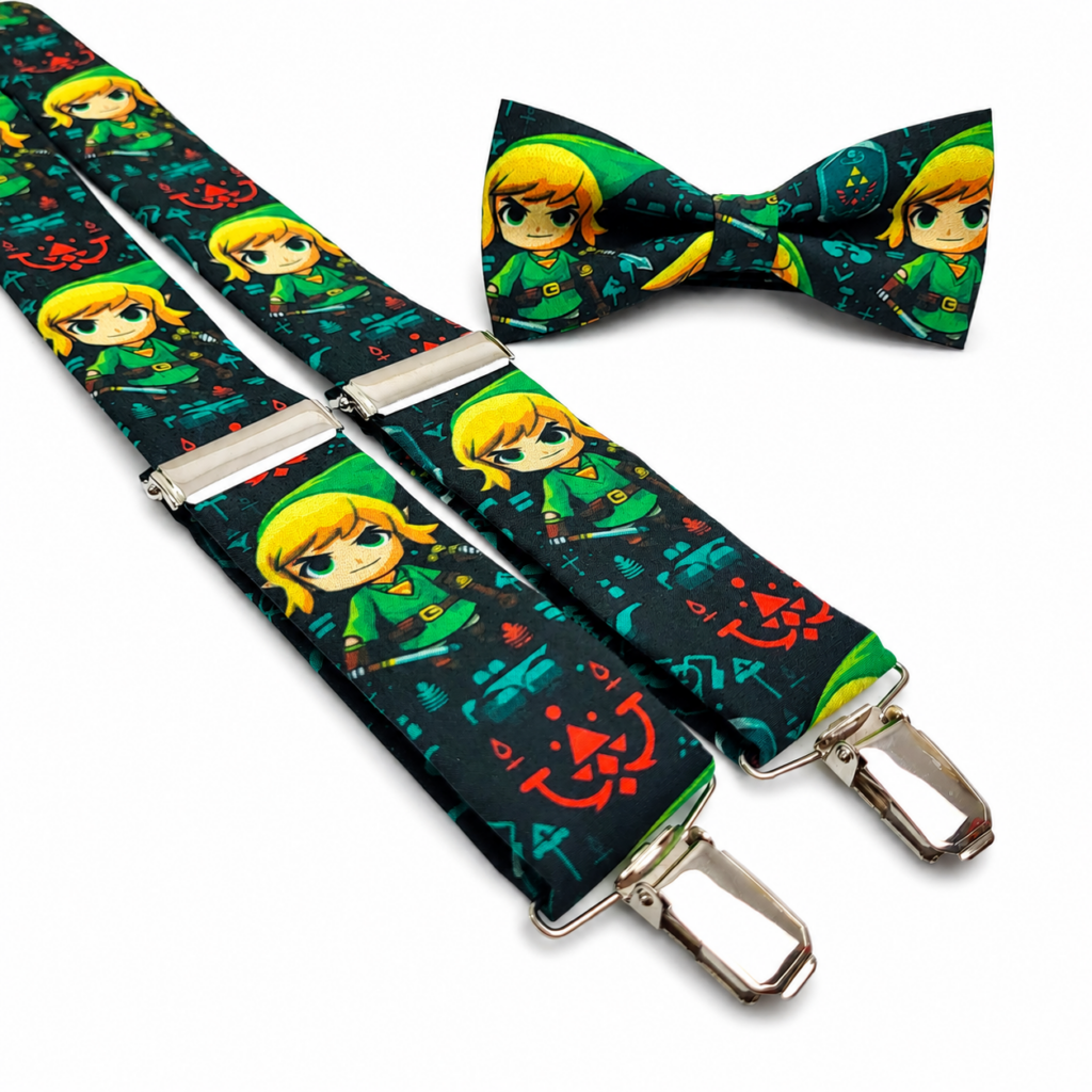 Pajarita y Tirantes Zelda artesanales para hombre confeccionados en algodón y fabricados a mano en nuestro taller de Pajaritas con Jota en Murcia, España. Conjunto coordinado con fondo negro o azul muy oscuro y estampado de personajes de cabello rubio vestidos principalmente en verde, acompañados de símbolos y pequeños detalles en azul turquesa, rojo, verde, amarillo, naranja y marrón. Los tirantes incorporan reguladores y pinzas metálicas plateadas y la pajarita está confeccionada con el mismo tejido. Pajarita y Tirantes Zelda para bodas, novios, invitados, padrinos, testigos, comuniones, bautizos, fiestas y eventos especiales. Complemento original inspirado en videojuegos y fantasía, perfecto con camisa blanca y traje azul marino, negro, gris, verde botella o beige. Regalo original para aficionados a Zelda, gamers y amantes de complementos diferentes. English SEO ALT text — more than 100 words Zelda bow tie and suspenders set for men handmade from cotton in our Pajaritas con Jota workshop in Murcia, Spain. Matching bow tie and suspenders featuring a dark black or very dark blue background with blonde fantasy characters dressed mainly in green, surrounded by decorative symbols and small turquoise blue, red, green, yellow, orange and brown details. The suspenders include adjustable silver metal fittings and strong metal clips, while the matching bow tie is made from the same printed cotton fabric. This Zelda bow tie and suspenders set is perfect for weddings, grooms, wedding guests, best men, communions, baptisms, parties, ceremonies and special events. An original video game inspired accessory that looks excellent with a white shirt and navy blue, black, grey, bottle green or beige suit. A unique handmade gift for Zelda fans and gamers. Texte ALT SEO en français — plus de 100 mots Ensemble nœud papillon et bretelles Zelda pour homme confectionné en coton et fabriqué artisanalement dans notre atelier Pajaritas con Jota à Murcie, en Espagne. Le nœud papillon et les bretelles sont réalisés avec le même tissu imprimé sur fond noir ou bleu très foncé. Le motif présente des personnages blonds habillés principalement en vert, entourés de symboles et petits détails bleu turquoise, rouges, verts, jaunes, orange et marron. Les bretelles disposent de réglages métalliques et de pinces argentées, tandis que le nœud papillon assorti complète parfaitement l’ensemble. Pajarita et bretelles Zelda idéales pour mariage, marié, invité, témoin, communion, baptême, fête, cérémonie et événement spécial. Accessoire original à combiner avec une chemise blanche et un costume bleu marine, noir, gris, vert bouteille ou beige. Cadeau original pour amateurs de Zelda et jeux vidéo. Testo ALT SEO in italiano — più di 100 parole Set Papillon e Bretelle Zelda da uomo realizzato in cotone e confezionato artigianalmente nel nostro laboratorio Pajaritas con Jota a Murcia, in Spagna. Il papillon e le bretelle sono prodotti con lo stesso tessuto stampato su fondo nero o blu molto scuro, con personaggi biondi vestiti principalmente di verde e numerosi simboli e piccoli dettagli nei colori blu turchese, rosso, verde, giallo, arancione e marrone. Le bretelle sono dotate di regolatori metallici e clip argentate, mentre il papillon coordinato completa l’insieme. Papillon e Bretelle Zelda perfetti per matrimonio, sposo, invitati, testimoni, comunione, battesimo, festa, cerimonia ed eventi speciali. Accessorio originale da abbinare a camicia bianca e abito blu navy, nero, grigio, verde bottiglia o beige. Regalo artigianale originale per appassionati di Zelda e videogiochi.